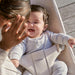 caption-Baby sits outdoors in Baby Bjorn Bouncer Bliss 