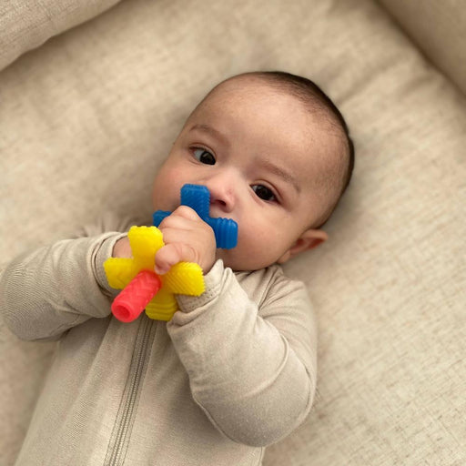 caption-Itzy Ritzy Teensy Teething Tube Silicone Toy