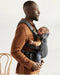 caption-Father wearing Baby Bjorn Harmony with infant facing him