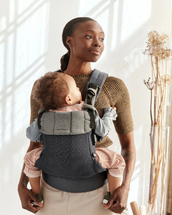 caption-Mother wearing Baby Bjorn Harmony with toddler facing in