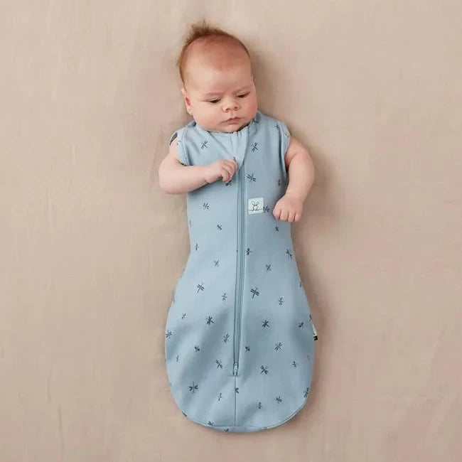 caption-Baby wearing Ergo Cocoon with arms out