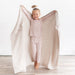 caption-Child with Kyte Baby Chunky Knit Toddler blanket in oat