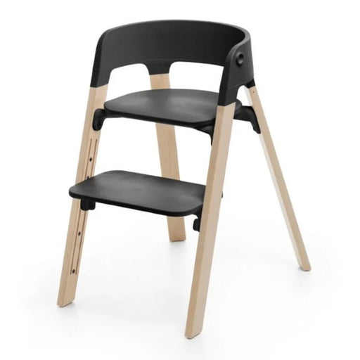 caption-Stokke Steps Chair in Black with Natural Legs