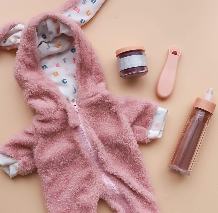 caption-flatlay of doll outfit with doll accessories