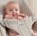 caption-Infant lounges in Baby Bjorn Rocker